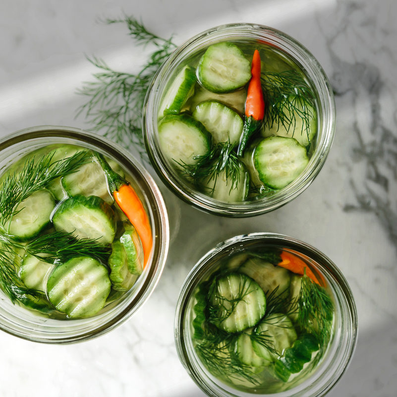dill pickles in glass jars