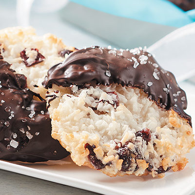 salted chocolate dipped cranberry macaroons in a plate