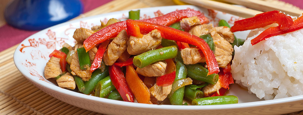 stir fry on a plate with rice