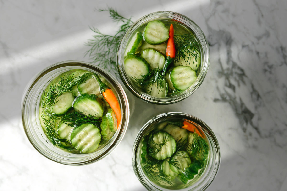dill pickles in glass jars